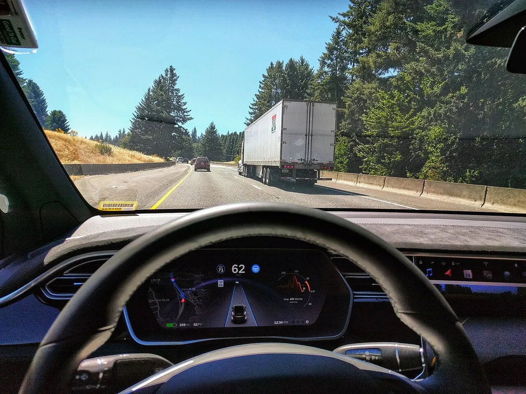 Driving in traffic with Tesla's autopilot controlling distance from the lead car and centering the vehicle in the lane. Vehicle is a 2017 Mo